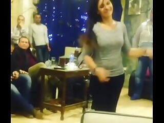 arab dame dancing with friends in cafe